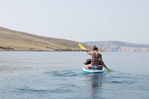 istock Woman paddling 1155051255