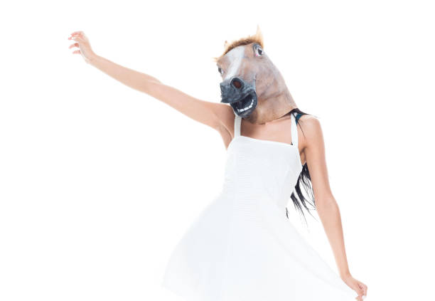 istock Cute female wearing a horse head 1155052302