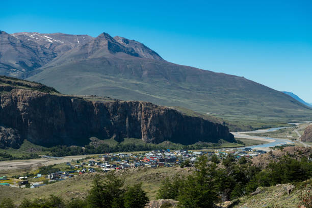 istock Scenic view of majestic mountain by town 1155053708