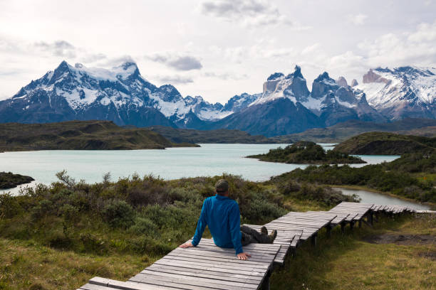istock Man relaxing on boardwalk at National Park 1155053790