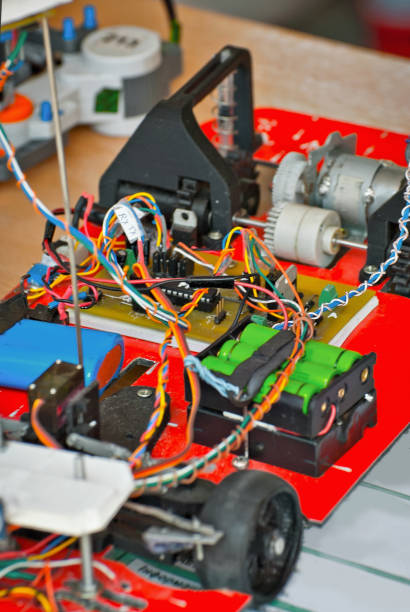 istock Electronics and robotics of handmade. Microcircuits and colored wires close up. Electronic devices and mechanisms are presented at the scientific exhibition. 1155055818