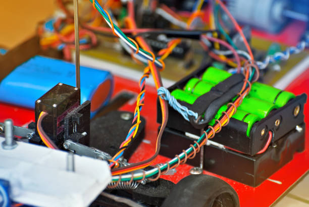 istock Electronics and robotics of handmade. Microcircuits and colored wires close up. Electronic devices and mechanisms are presented at the scientific exhibition. 1155055844