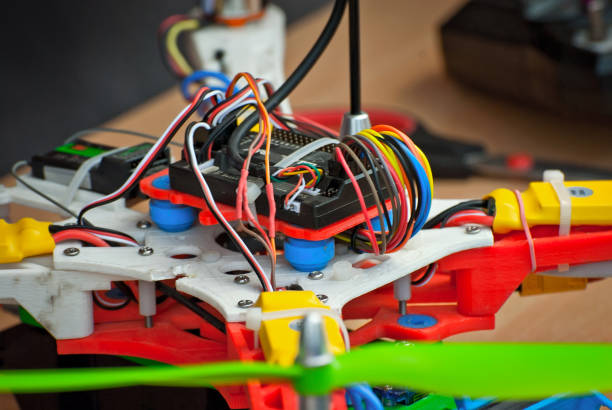 istock Electronics and robotics of handmade. Microcircuits and colored wires close up. Electronic devices and mechanisms are presented at the scientific exhibition. 1155055848