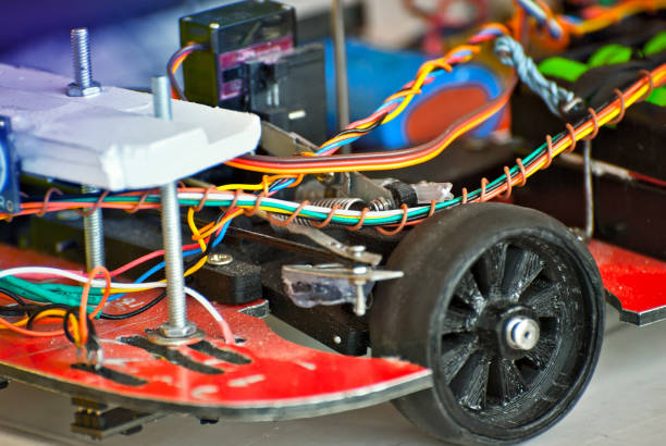 istock Electronics and robotics of handmade. Microcircuits and colored wires close up. Electronic devices and mechanisms are presented at the scientific exhibition. 1155055868