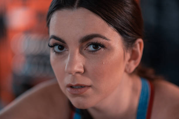 istock Woman working on weight loss sweating after workout 1155059151