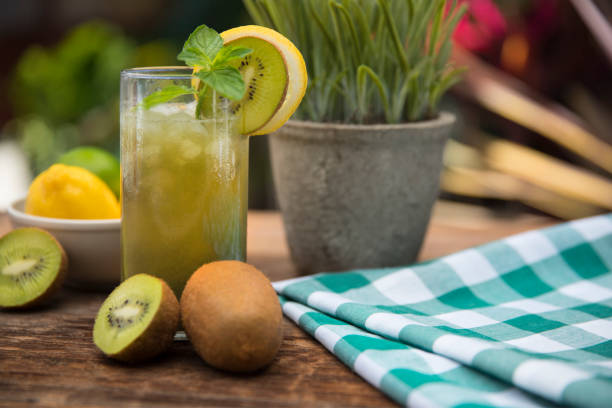 This is a close-up photograph of a Kiwi Lemon fresh fruit drink for the summer time with mint