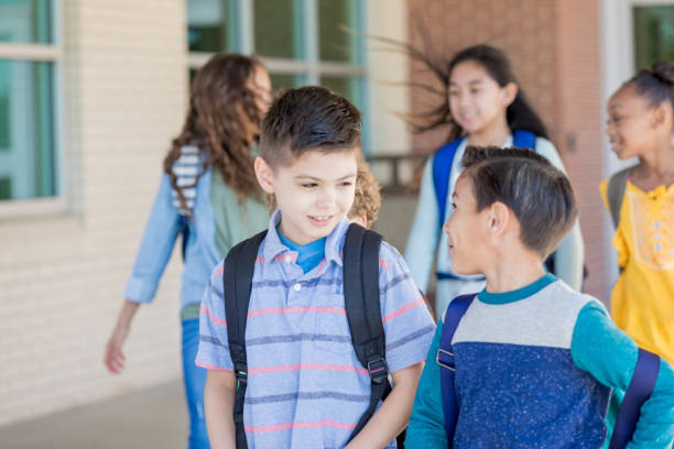 istock Schoolboy walks home with best friend 1155064316