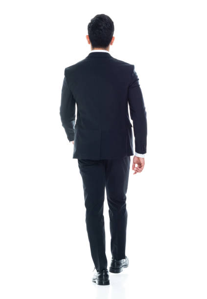 istock Attractive Asian businessman on white background - walking 1155064645
