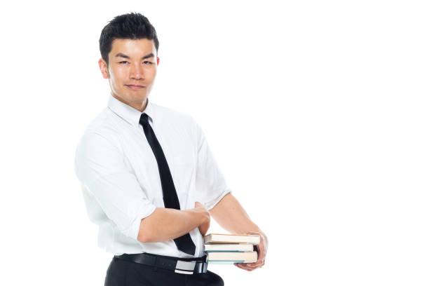 istock Handsome Asian Businessman - is holding books 1155064747