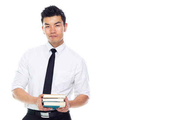 istock Handsome Asian Businessman - is holding books 1155064753