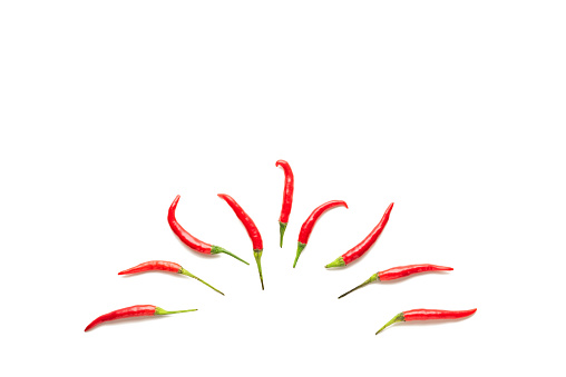 Fresh Red chili pepper isolated on a white background. Top view, flat lay Image. Spicy food pattern