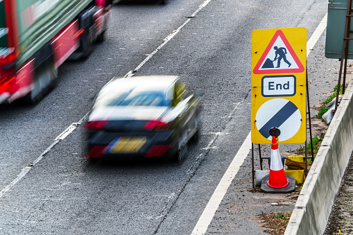 UK Road Services Roadworks End sign on motorway.