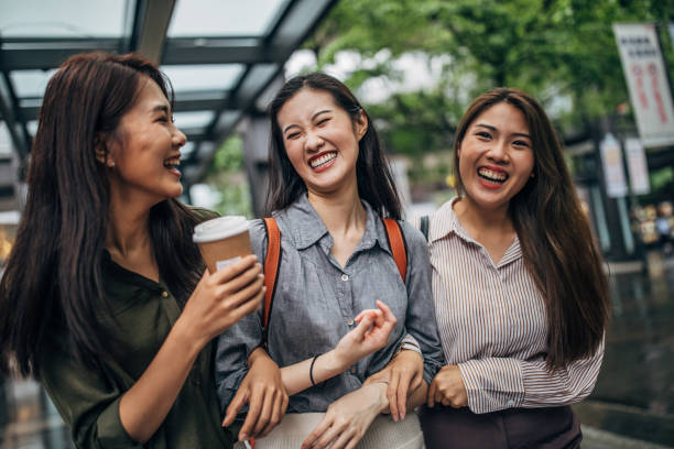 istock Three young friends walking in the city 1155069961
