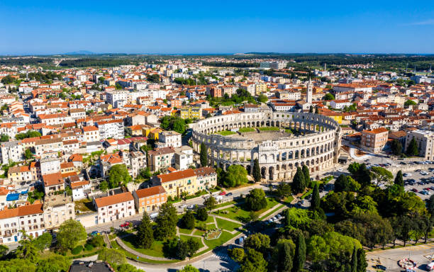 The Pula Arena in Croatia Aerial view of the Roman Amphitheatre in Pula, Croatia croatian culture photos stock pictures, royalty-free photos & images