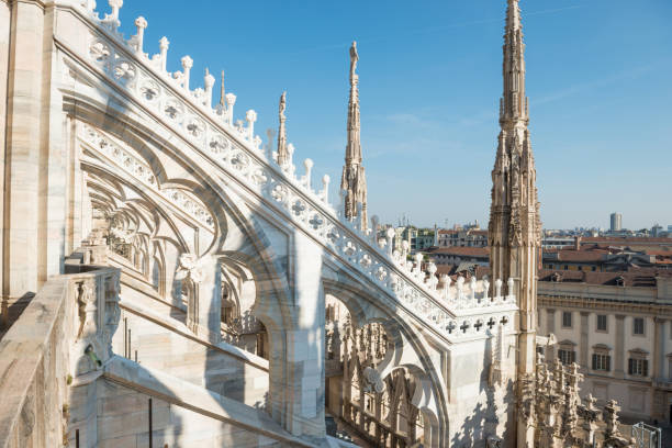 istock White statue on top of Duomo cathedral 1155072007
