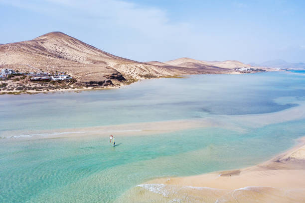 windsurfing in Canary islands,  windsurfer on beautiful beach