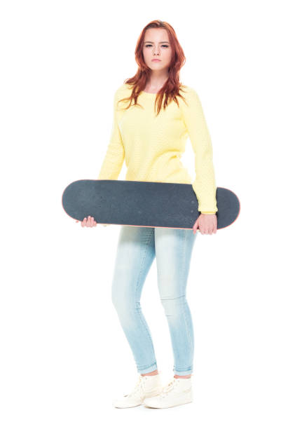 istock Cute female holding a skateboard 1155074643