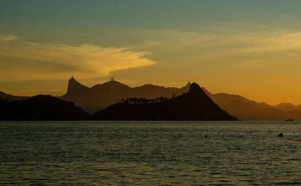 istock Mountains sea and golden sky 1155076252