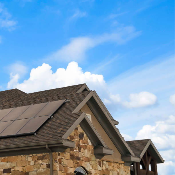 istock Square frame Cloudy blue sky over a home with solar panels on the pitched roof 1155076557