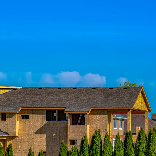 istock Square frame Exterior of a house under construction with blue sky background on a sunny day 1155076598