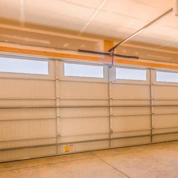 istock Square frame Interior of an unfinished garage with unpainted walls and ceiling 1155076620