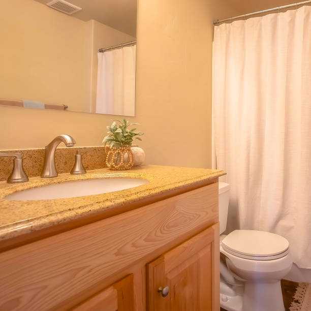 istock Square frame Toliet and vanity area inside a bathroom with towel rod and mirror on the wall 1155078733