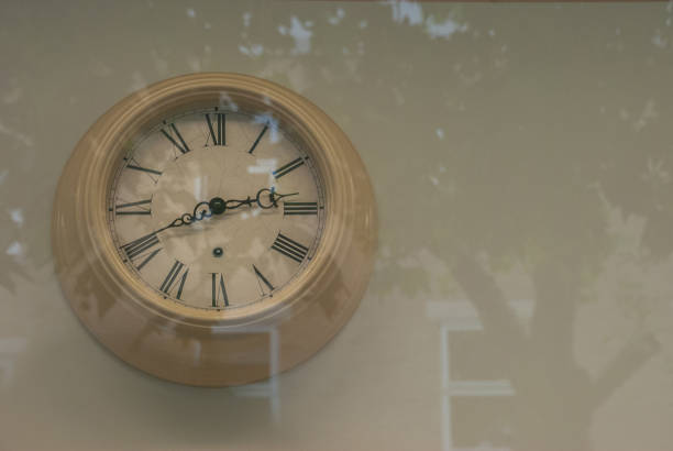 istock Vintage clock hanging at the wall. 1155091952