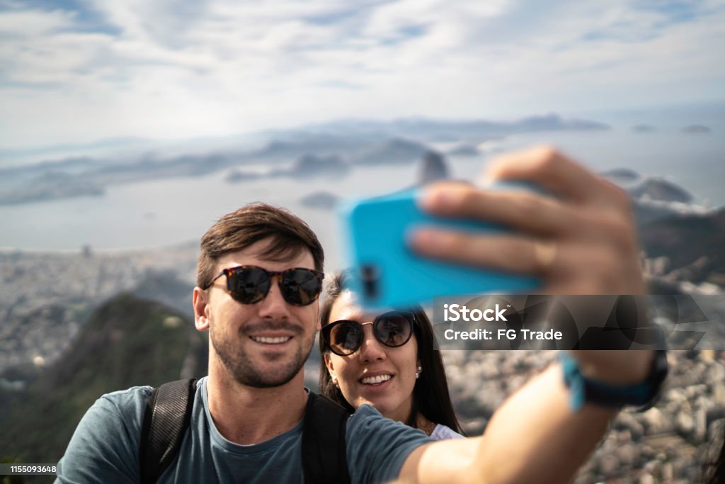 Tourist couple taking a selfie in Rio de Janeiro Travel Stock Photo