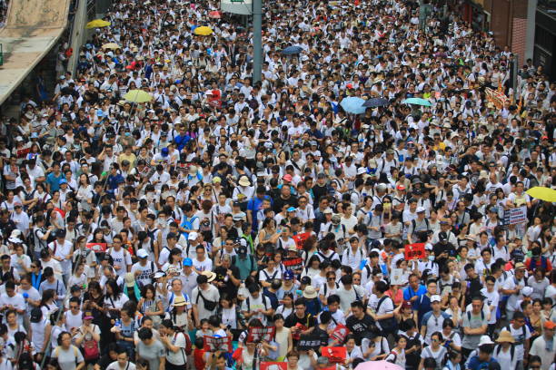 protest against controversial extradition bill Hong Kong- 9 June 2019: the crowd protest in the rally. More than 150,000 protesters with no main organisation, took to the streets of Hong Kong Sunday to oppose a controversial extradition bill political rally photos stock pictures, royalty-free photos & images