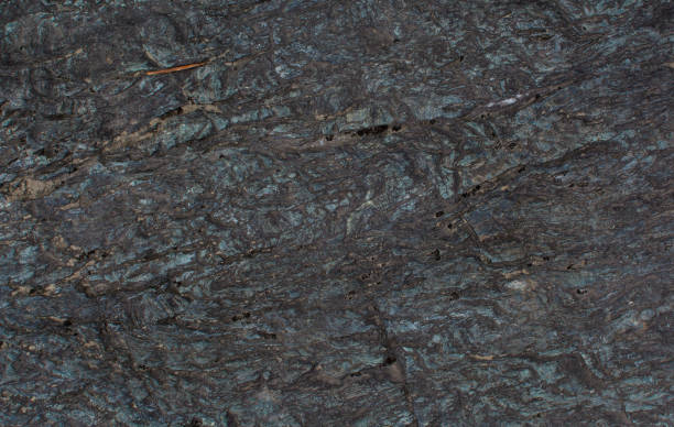 istock The texture of the stone. Dark background. Relief surface 1155096023
