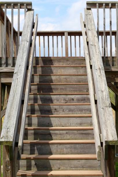 istock Wood Stairs in Sunlight 1155097295