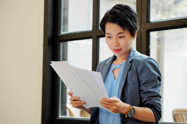 istock Businesswoman reading a contract 1155099151