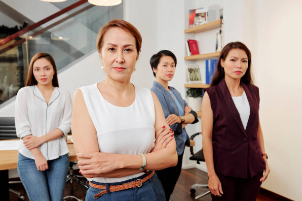 istock Female leader with her team 1155099587