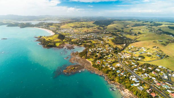 Overlooking long stretch of Cable bay and Coopers Beach, Northland, New Zealand. Aerial view of Cable Bay, in Doubtless bay area, North Island, New Zealand. northland new zealand stock pictures, royalty-free photos & images