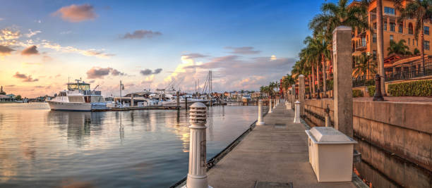 Sunset over the boats in Esplanade Harbor Marina in Marco Island Sunset over the boats in Esplanade Harbor Marina in Marco Island, Florida marco island stock pictures, royalty-free photos & images