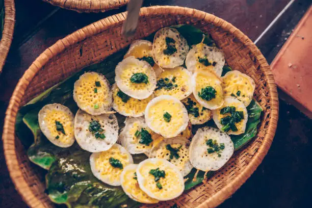 Photo of Vietnamese mini fried eggs, cooking on the street - Traditional Vietnamese food