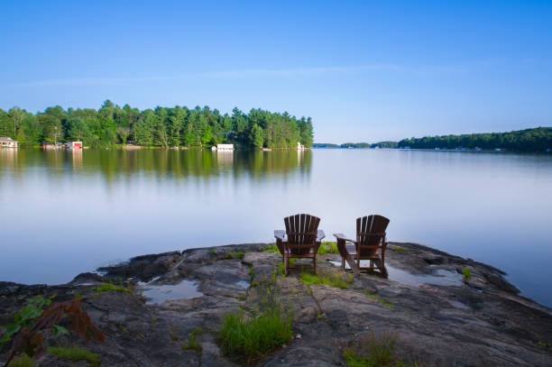 istock Adirondack chairs on a rock formation 1155107931