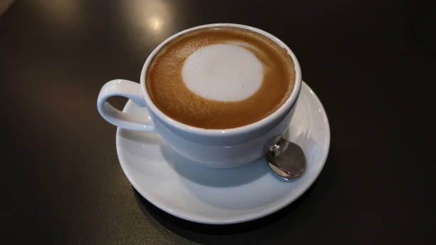 istock close up of coffee cup on table in cafe 1155108608