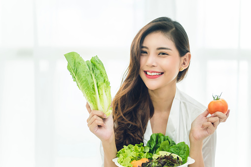Beautiful Asian woman with healthy food. Heathy life style and Beautiful skin care food concept.