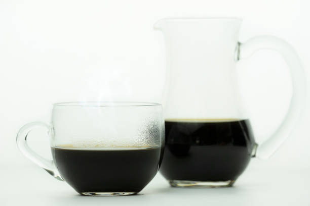istock cup of coffee  and jar on white background 1155116474