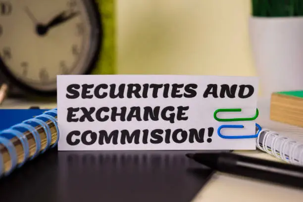 Photo of Securities and Exchange Commision! on the paper isolated on it desk. Business and inspiration concept