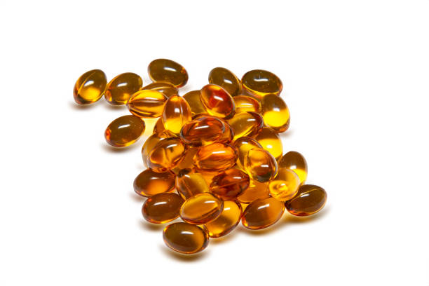 soft gel capsules supplement  isolated with clipping path - fish oil vegetable capsule healthy eating imagens e fotografias de stock