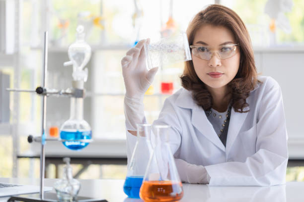 istock Scientist holding test tube tray in her hand. 1155126062