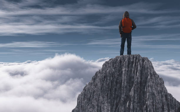 istock Hiker on top of mountain peak above clouds. This is a 3d render   illustration 1155127542