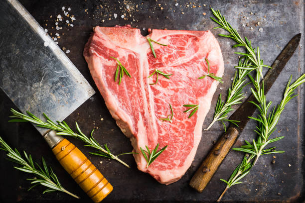 istock Raw fresh marble T-bone meat on the rustic background 1155128330