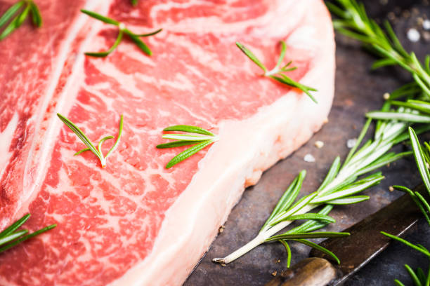 istock Raw fresh marble T-bone meat on the rustic background 1155128346
