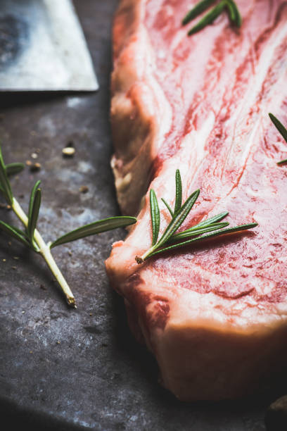 istock Raw fresh marble T-bone meat on the rustic background 1155128348