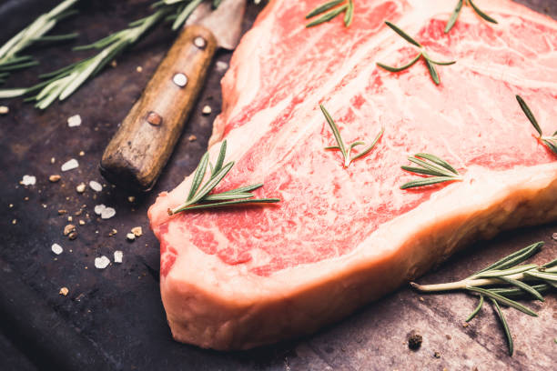 istock Raw fresh marble T-bone meat on the rustic background 1155128373