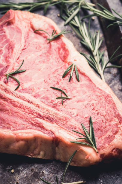 istock Raw fresh marble T-bone meat on the rustic background 1155128378