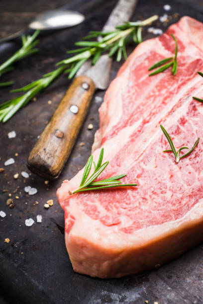 istock Raw fresh marble T-bone meat on the rustic background 1155128385